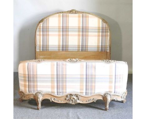 A later 20th century French limed and cream check upholstered double bedstead, with a slatted wooden base, 147cm wideOverall 