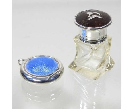 An early 20th century silver and blue guilloche enamel ladies compact, 45mm diameter, together with an early 20th century gla