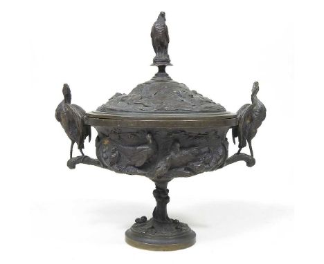 A 19th century cast bronze cup and cover, of pedestal form, decorated in relief with game, flanked by a pair of birds, 19cm h