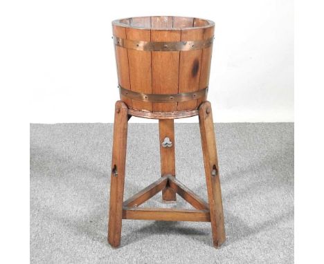 An Arts and Crafts coopered light oak jardiniere, on stand32w x 74h cm