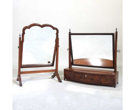 A Regency mahogany and ebony strung bow front toiletry mirror, 56cm wide, together with another. Note: a non-transferable ivo