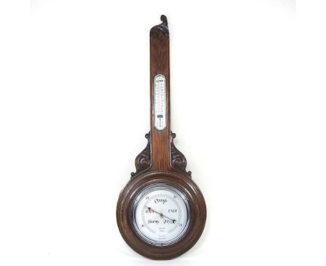 An early 20th century oak cased aneroid barometer, 89cm high