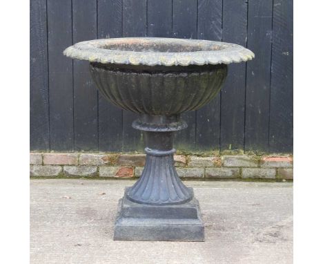 A large black painted cast iron garden planter, of fluted pedestal design97d x 93h cm