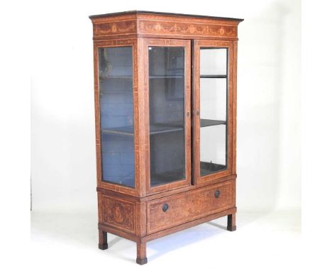 A 19th century Dutch marquetry vitrine, decorated with swags, portrait medallions and festoons, within a stiff leaf border, e
