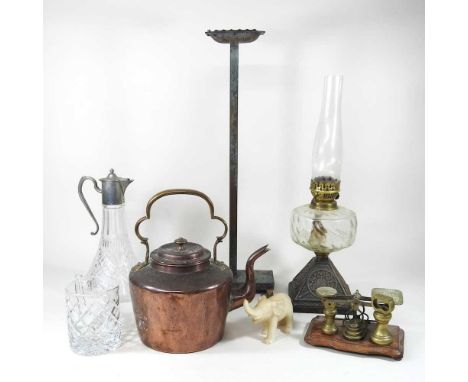 A Victorian copper kettle, together with a set of early 20th century postal scales, an oil lamp and other items