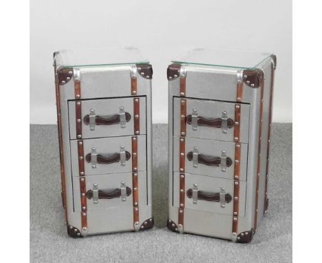 A pair of modern bedside chests, each in the form of a trunk, with a glass top (2)31w x 31d x 62h cm