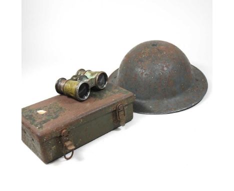 A military metal helmet, together with a war time first aid box and a pair of binoculars