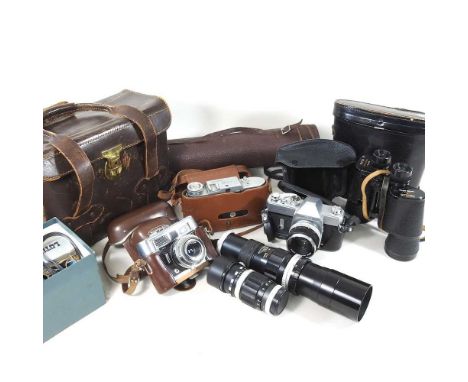A vintage Voigtlander Lanthar camera, cased, together with a Voigtlander Bessa I, a Mamiya Sekor 500 DTL, various lenses and 