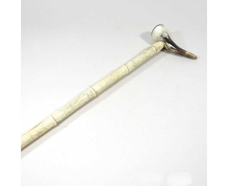 A Chinese carved bone sectional walking stick, with a horn handle, 85cm long