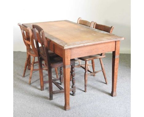 An early 20th century light oak dining table, together with four knife back dining chairs (5)149w x 80d x 78h cm