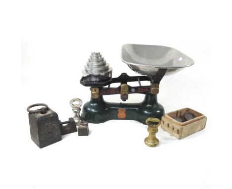 A set of mid 20th century cast iron kitchen scales, 38cm wide and weights