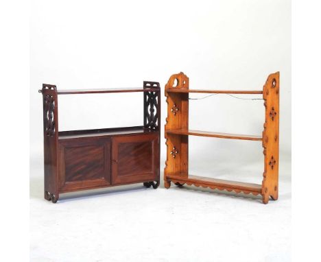 An Edwardian mahogany hanging shelf, 56cm wide, together with another (2)