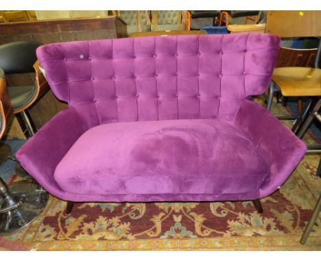 A MODERN PURPLE SHAPED TWO SEATER SOFA