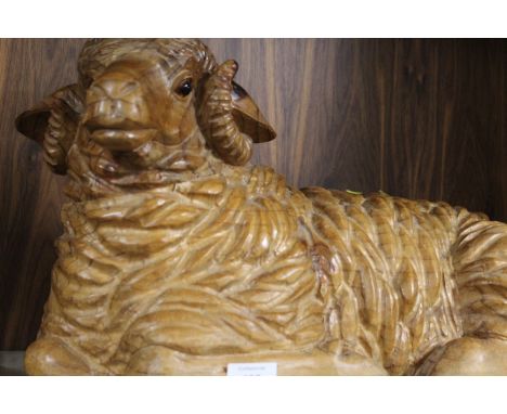 A CARVED WOODEN MODEL OF A RECUMBENT RAM