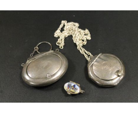 TWO HALLMARKED SILVER POWDER / SNUFF PENDANTS - A/F, TOGETHER WITH A SMALL ENAMELLED 'BASKET' CHARM (3)