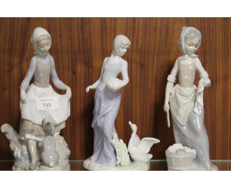 A NAO FIGURE OF A GIRL WITH A RABBIT TOGETHER WITH TWO SIMILAR FIGURES (3)