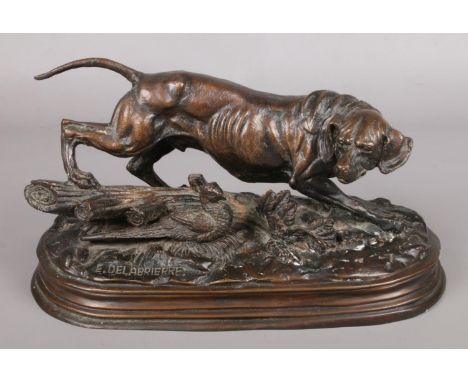 After Paul-Edouard Delabrierre (E. Delabrierre); a Bronze figure of a hunting dog, with pheasant. Raised on bronze stepped pl