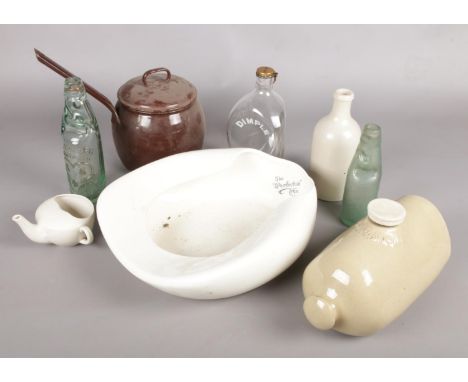 A box of miscellaneous. Including glass bottles, enamel pan, stoneware hot water bottle, etc.  
