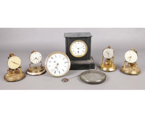 A small quantity of torsion clocks, all missing domes, together with a slate mantle clock and clock movement stamped for H. C