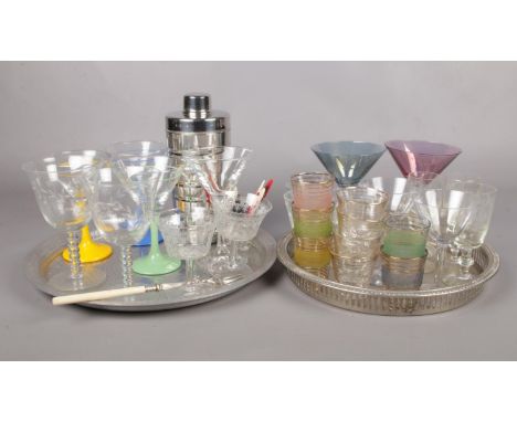 Two trays of cocktail accessories. To include vintage glasses, cocktail shaker and cocktail forks etc.  
