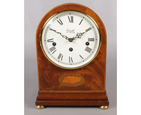 A mahogany cased Comitti of London mantel clock. Decorated with shell patera. With Franz Hermle movement.  Key present.