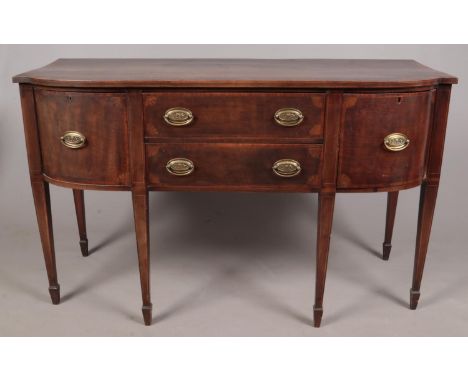 A Regency mahogany sideboard. With fan patera inlay to corners of cupboard doors and drawers. Height 92cm Width 152cm Depth 6