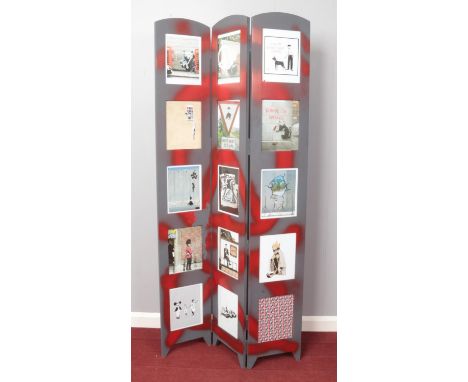 A folding screen with Banksy prints in each panel. H:176cm W:89cm  