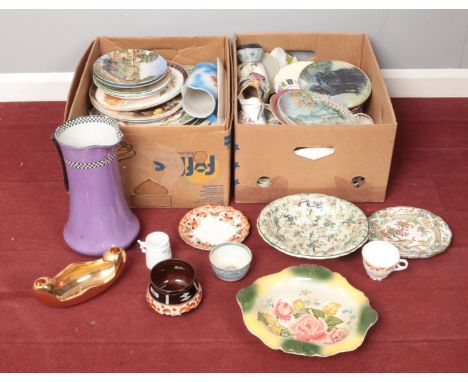 Two boxes of miscellaneous. Including whistle cup, cabinet plates, large purple ceramic jug, etc.  