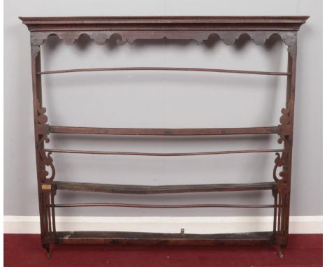 A period oak delft rack. Comprising of a scalloped frieze over three open shelves. H: 111.5cm, W:119cm, D:14cm.  Beading loos