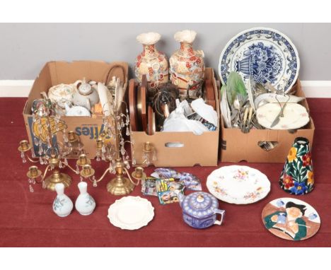 Three boxes of miscellaneous. Including pair of brass candelabra with glass droplets, ceramic charger, flatware, pair of orie