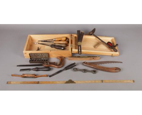 A wooden tool box containing an assortment of vintage tools. To include a Rabone Chesterman spirit level, Stead &amp; Co (She