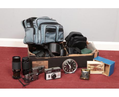 A box of assorted photographic equipment and clocks. To include Ilfordmatic Super 100, a Hahnel HC-6D infrapro for Canon DSLR
