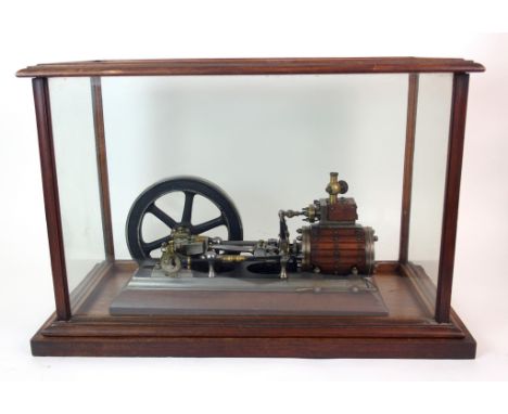 A live steam scale model of a horizontal mill type engine in glazed case, the engine bed plate 38cm x 12cm, the flywheel 21cm