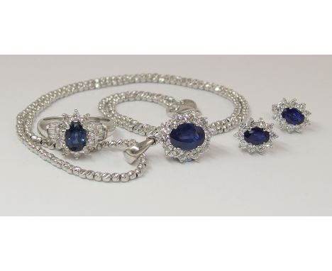 A suite of diamond and sapphire jewellery comprising of an 18ct white gold ring set with an oval cut sapphire of approximatel