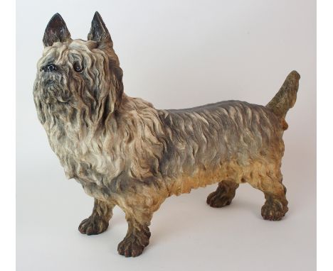 A Royal Worcester figure of a Scottish Terrier depicted standing with inset glass eyes, polychromed, Worcester mark impressed