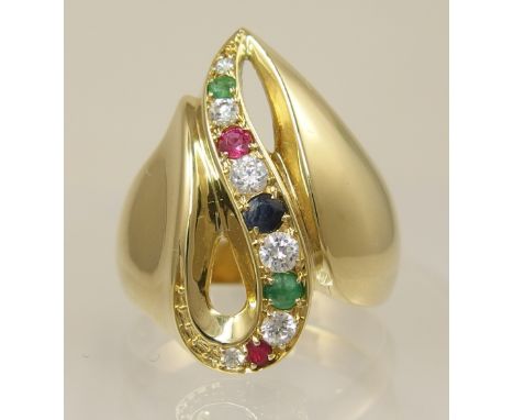 A 14ct substantial dress ring of abstract shape pave set with a row of clear gemstones, rubies, emeralds and sapphire. Finger