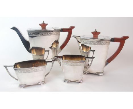 A four piece silver tea service by Stower & Wragg Limited, Sheffield 1949, of curved rectangular form with foliate engraved b