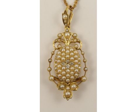An Edwardian pearl and diamond pendant brooch an oval domed centre pave set with split pearls centred with four old cut diamo
