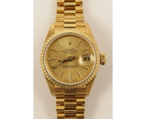 An 18ct ladies Rolex  the champagne coloured dial stamped Rolex Oyster Perpetual Date Just superlative Chronometer Officially