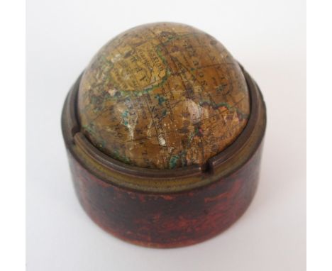 A terrestrial pocket globe marked Newton's New Terrestrial G*obe 1836 in bottom half of leather bound pine case (top half mis