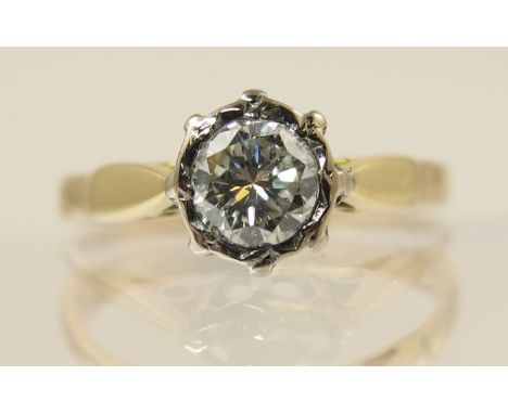 A 0.40ct diamond solitaire mounted in yellow and white metal. Finger size K.