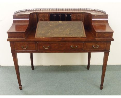 A Carlton House mahogany writing desk
of traditional form, 20th Century, 101cm high x 122cm x 67cm deep 