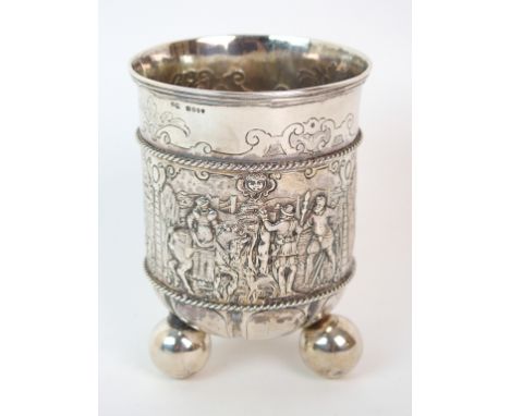 An 18th Century German silver beaker with import marks for Berthold Muller, London 1896, of cylindrical shape, finely embosse