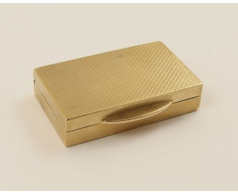 A 9ct pill box with engine turned engraving to the top hallmarked 1961 AD in a diamond for Alfred Dunhill.  Dimensions 32mm x