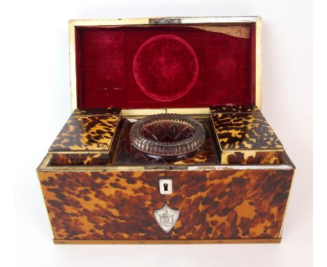 An English Regency tortoiseshell tea caddy circa 1820, of rectangular-form, sectioned hinged lid centred with silver plaque, 