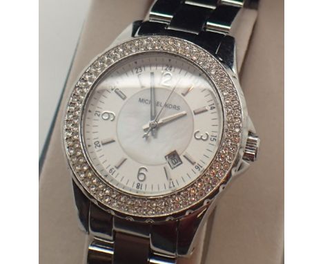 Michael Kors silver tone ladies quartz date dial ladies wristwatch MK5401 with crystal bezel  CONDITION REPORT: This item is 