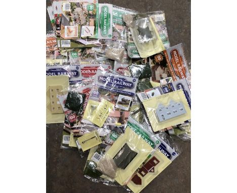 Model Railway Village twenty two sealed magazines complete with the relevant railway parts ( includes some further loose maga