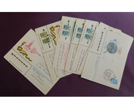 Russia 1980 Moscow Olympics themed group of 8 pre-paid illustrated envelopes showing different city scenes all with Olympic c