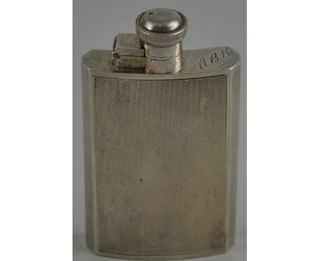 A solid silver Deco hip flask with bright cut decoration marked Sheffield 1936