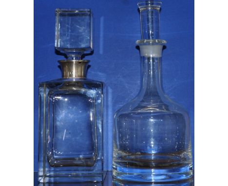 A modern silver mounted glass spirit decanter and stopper together with another glass decanter